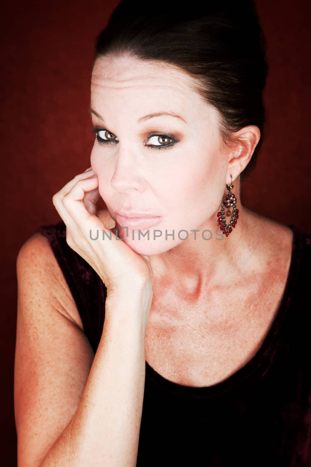 Beautiful Mid Adult Woman on a Red Background