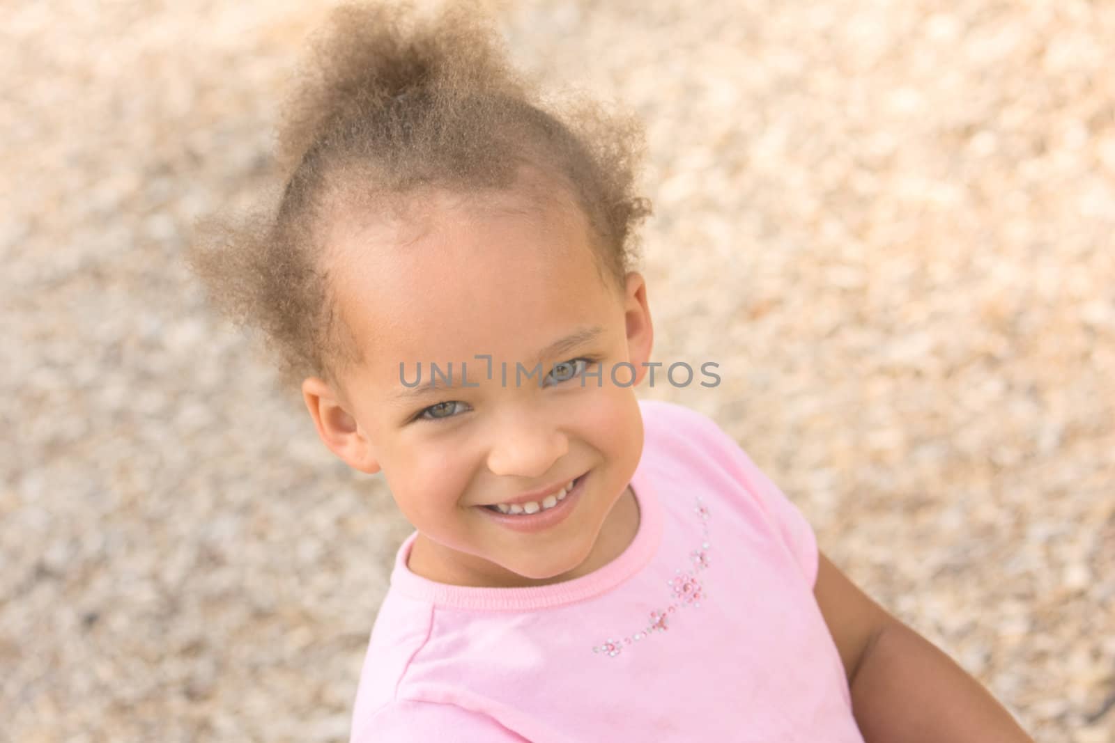 Beautiful Young Ethnic Girl wearing a pink shirt