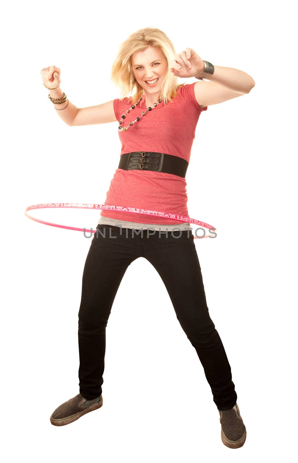 Pretty blonde girl twirling a toy hoop around her waist