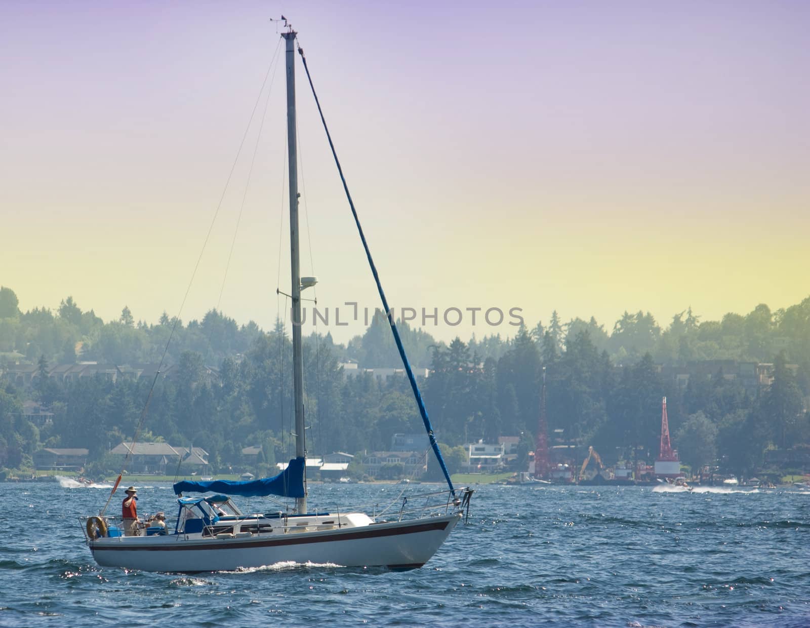 Sailboat without sails on Lake Washington viewed from Medina Beach.