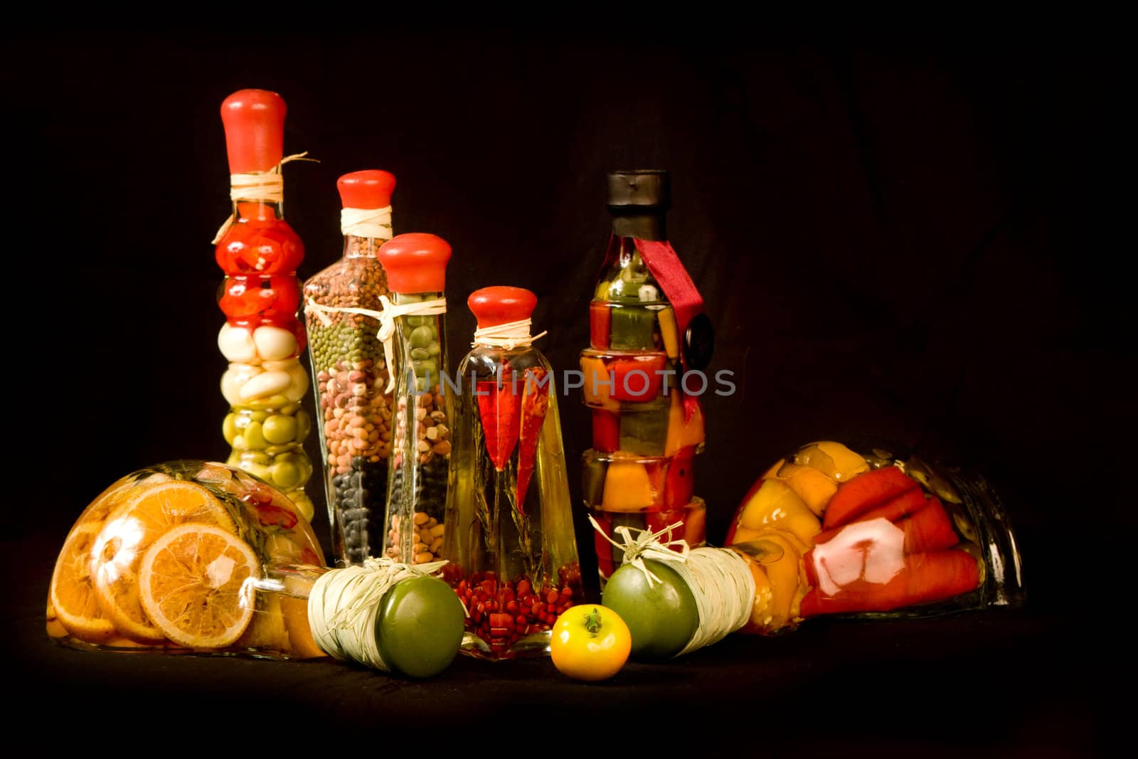 Gourmet Cooking Chef Peppers Seasonings and Spices isolated on a black background.