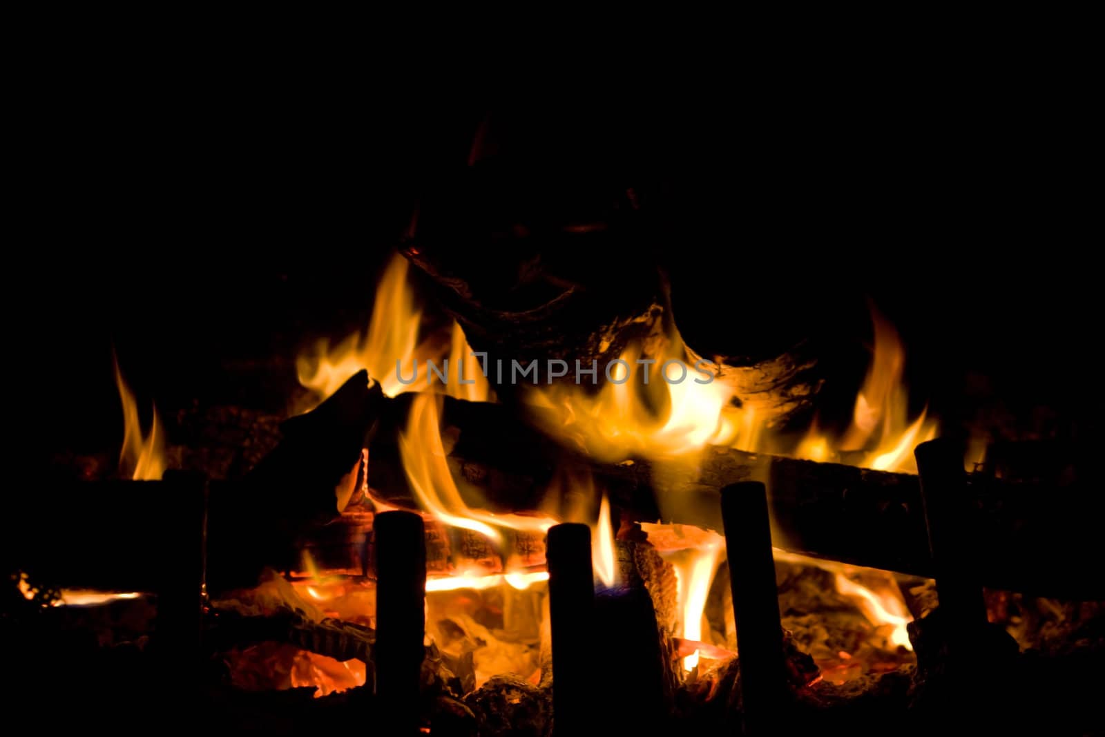 Flames of Fire in a fireplace.