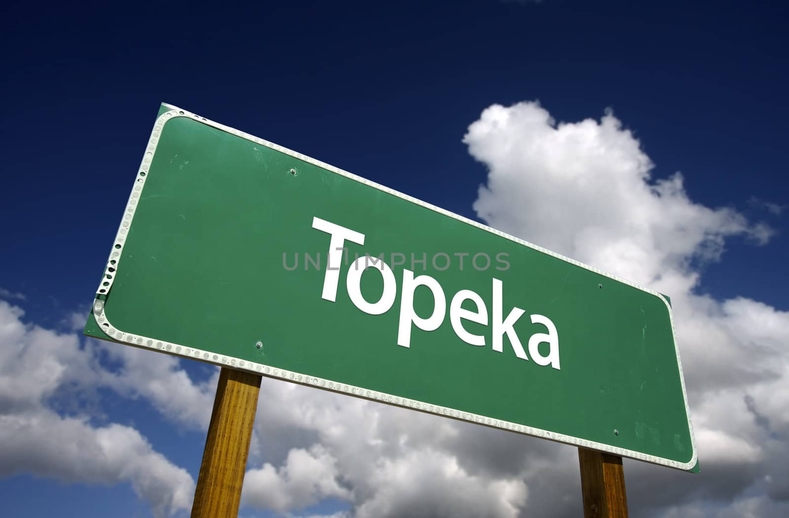 Topeka Road Sign with dramatic blue sky and clouds - U.S. State Capitals Series.