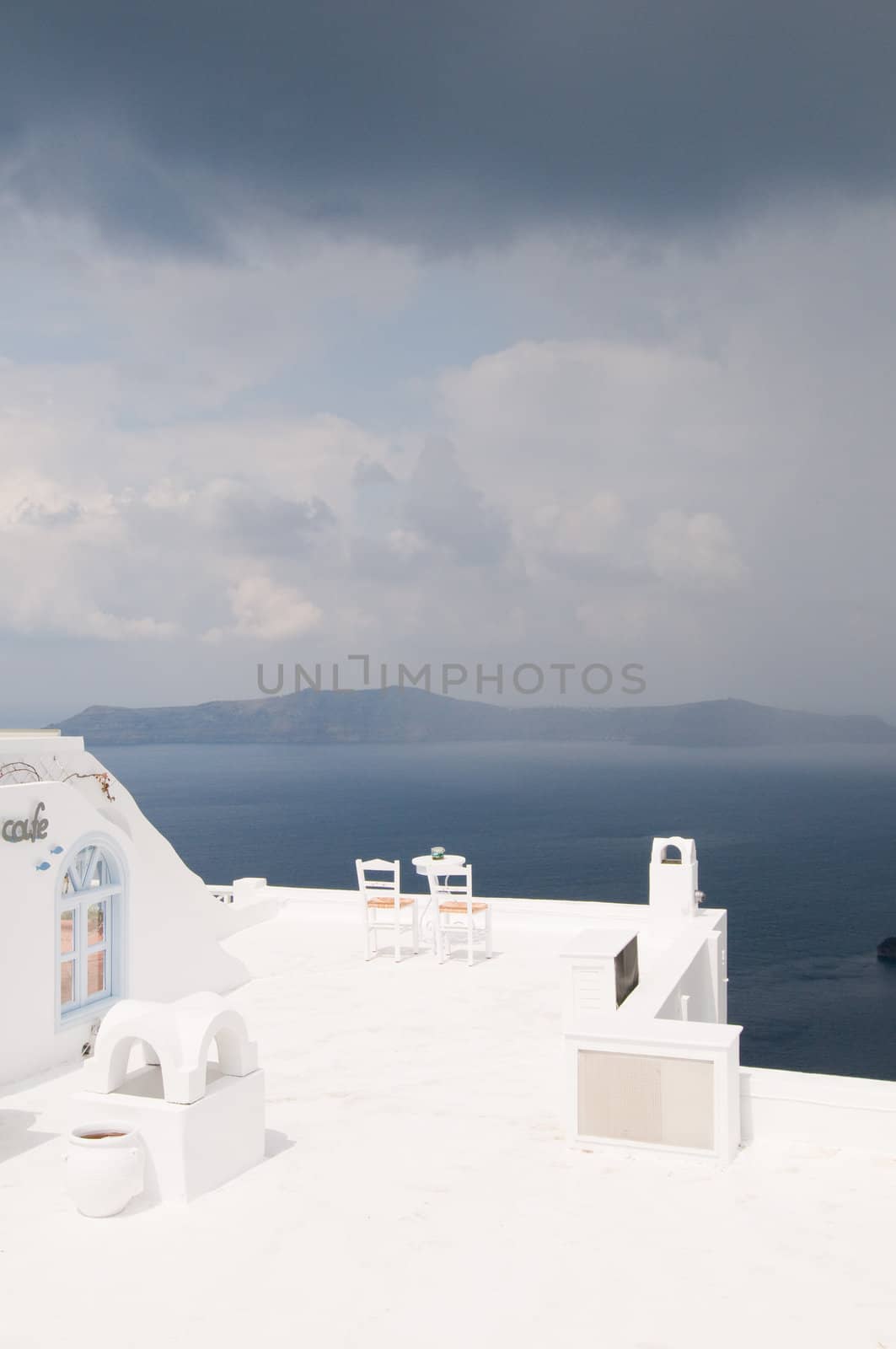 Two chairs on Santorini island, beautiful view, romantic