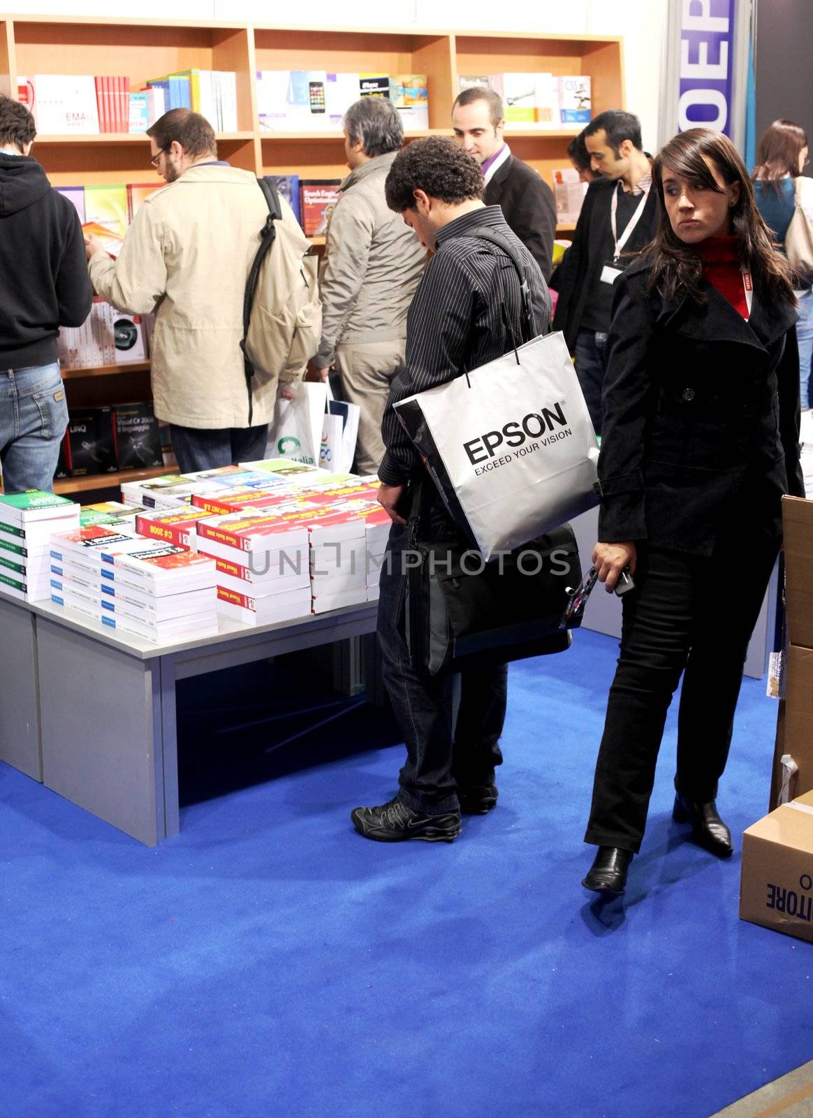 People looking for books at Smau, national fair of business intelligence and information technology October 21, 2009 in Milan, Italy.