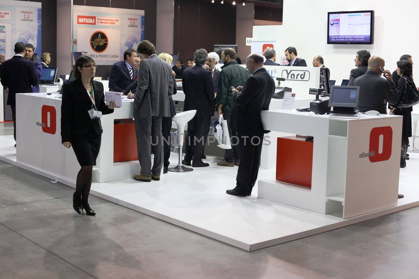 People asking for information at Olivetti stand, Smau, national fair of business intelligence and information technology October 21, 2009 in Milan, Italy.