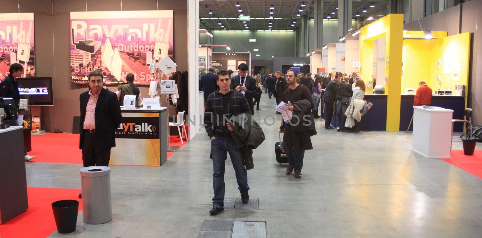 People walking trough the stands at Smau, national fair of business intelligence and information technology October 21, 2009 in Milan, Italy.