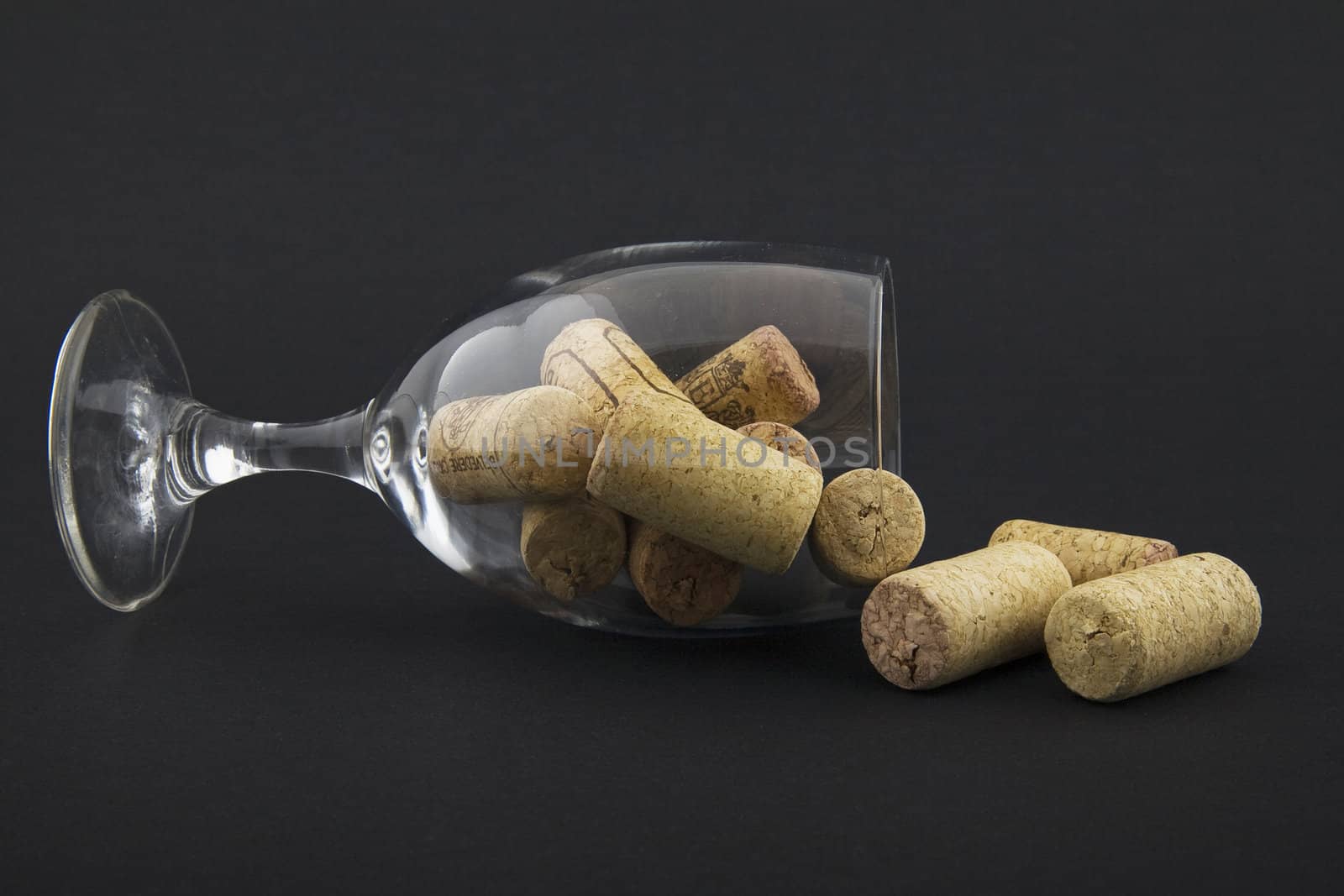 wineglass filled with corks by furzyk73