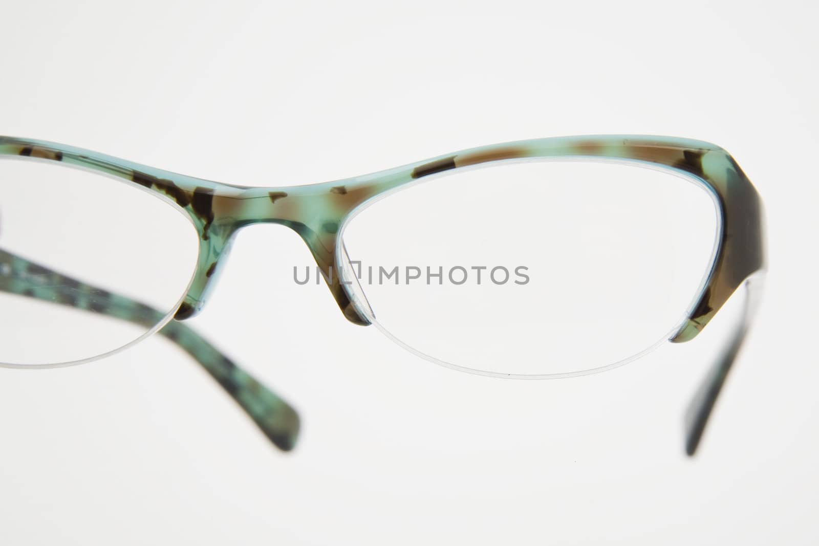 pair of green spectacles on dark background