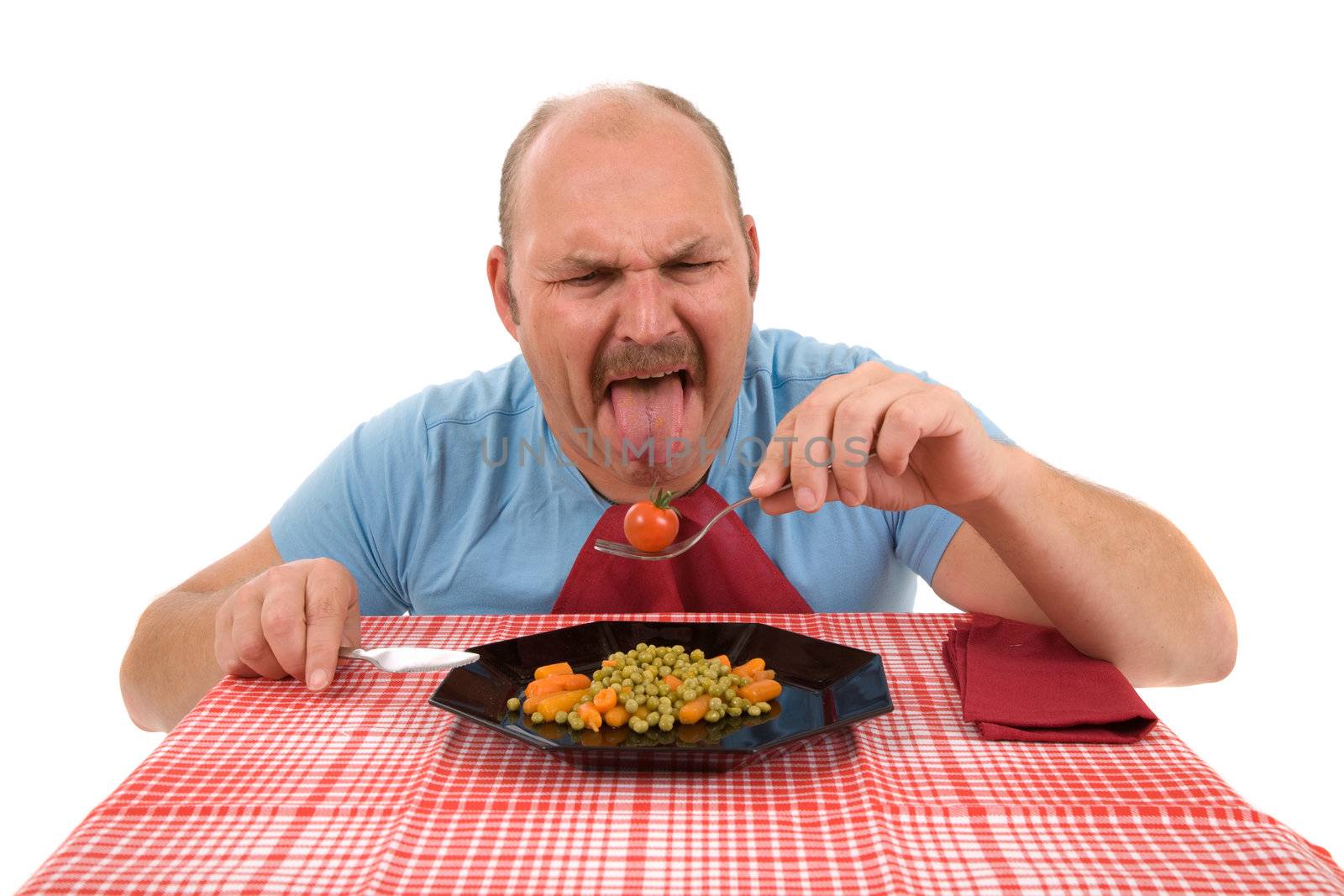 Mature man sticking out his tongue in disgust