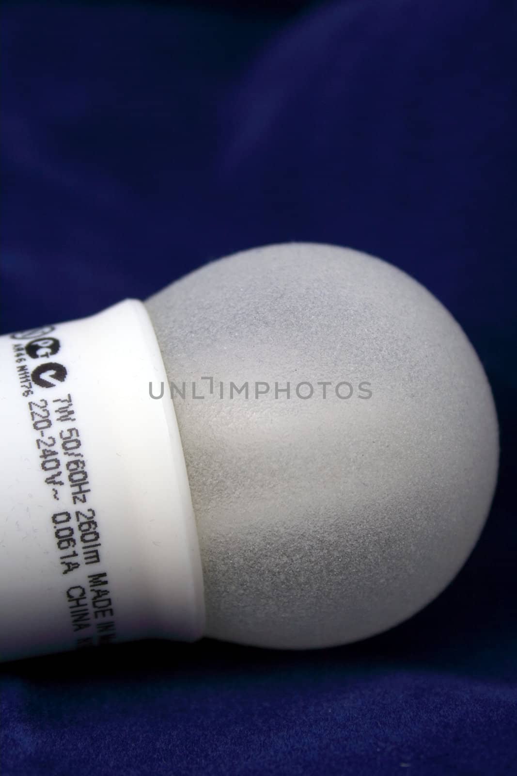 Close-up of a bulb on blue background.