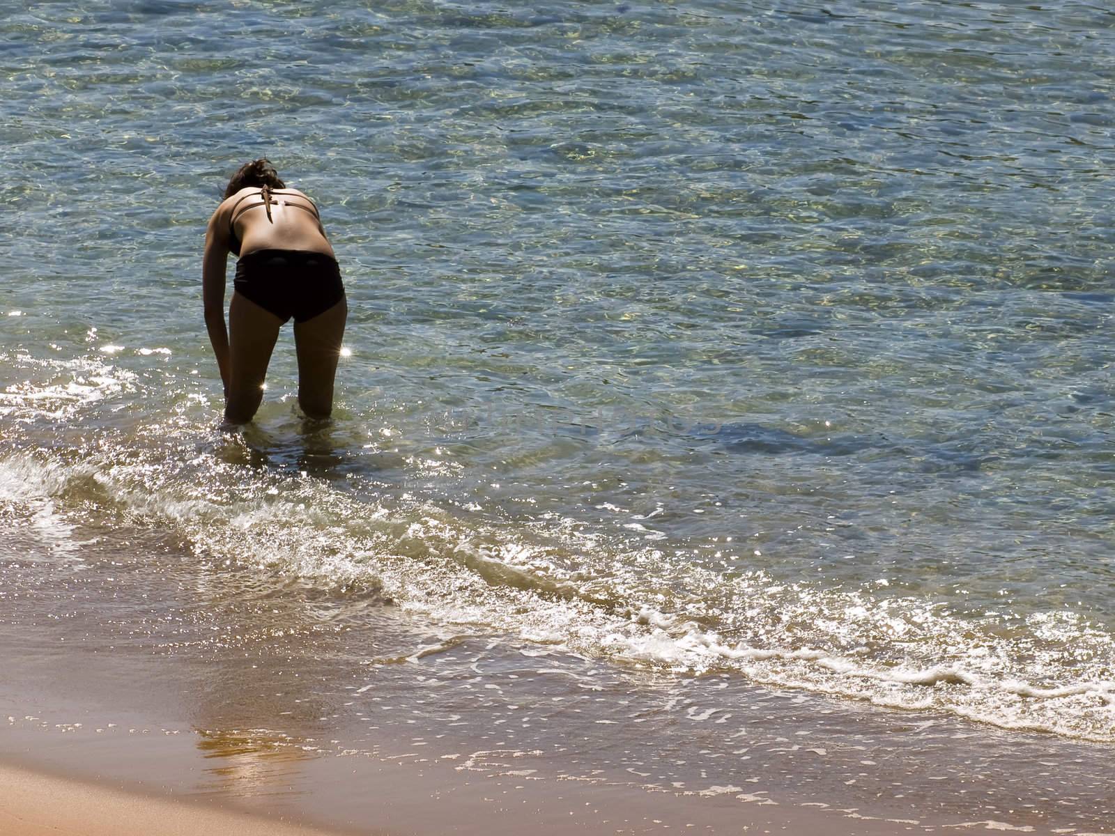 Woman in bikini at the beach in spring in Malta