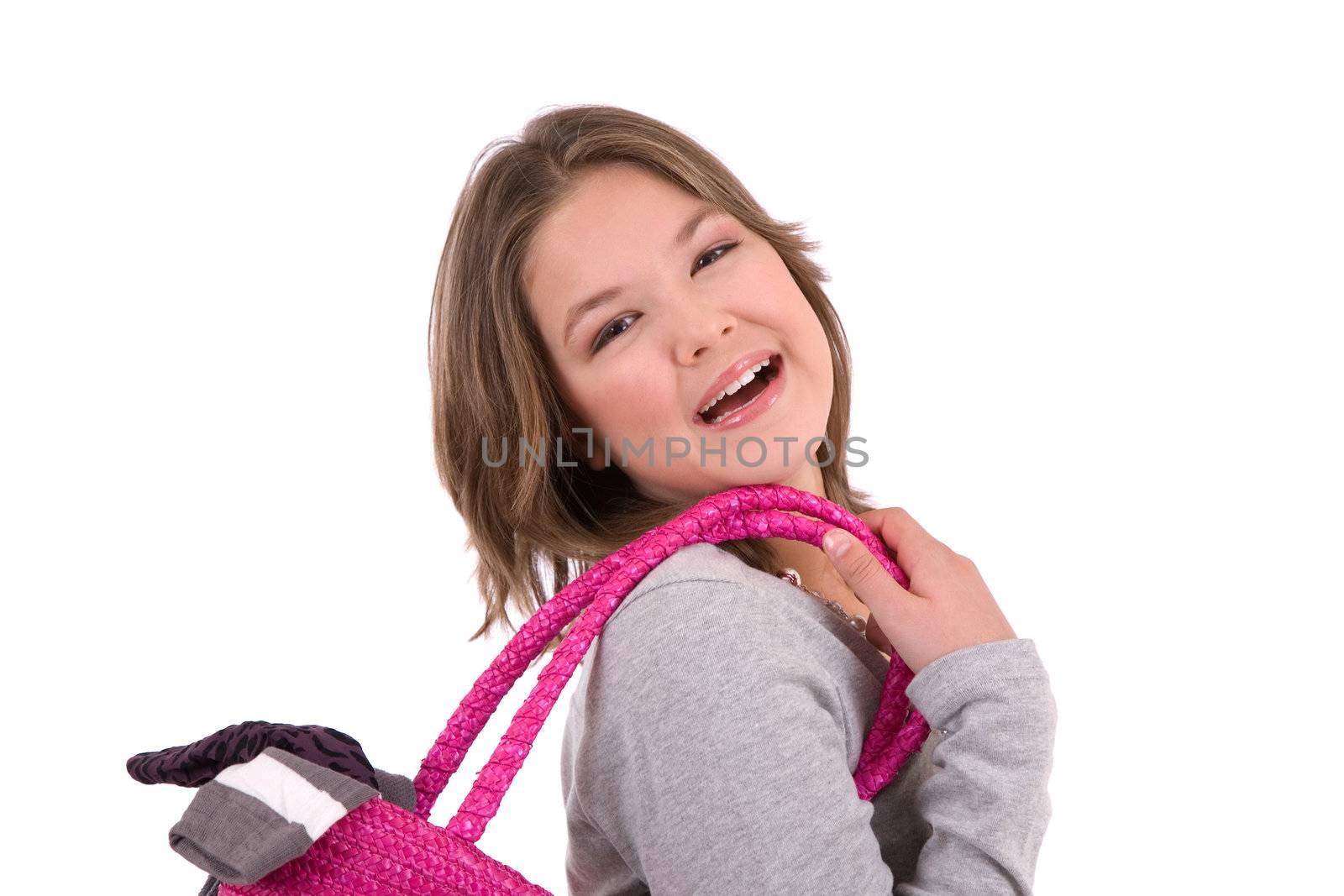 Cute teenage girl with shopping bag over her shoulder