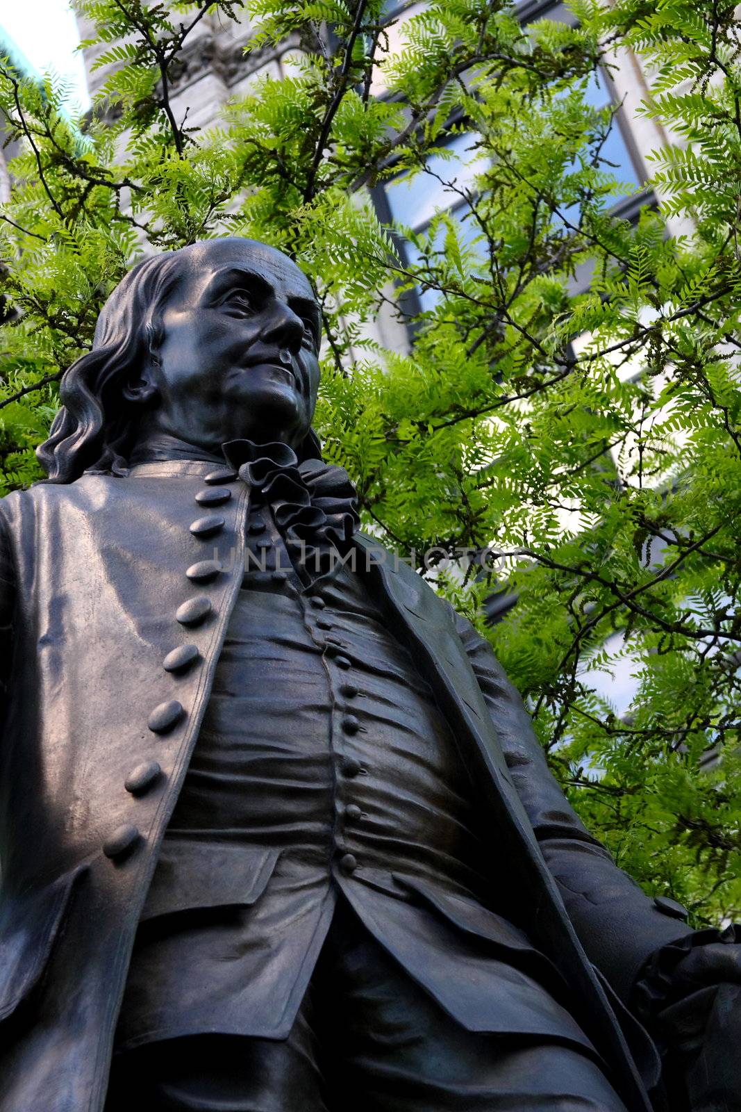 Statue of Benjamin Franklin in outdoor settings. Shot in New York City.
