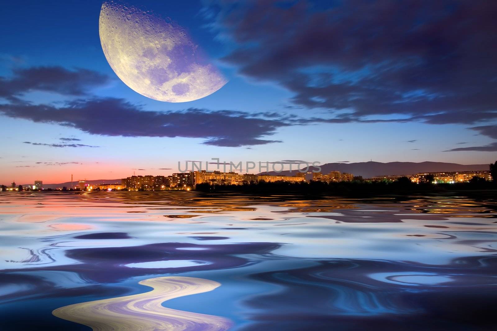 Town at sunset with moon and reflection