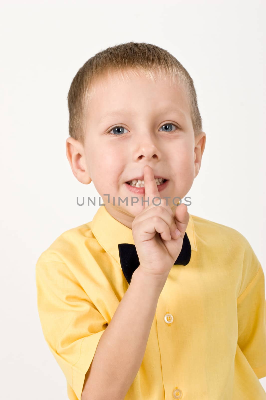 portrait of little boy on the yellow shirt