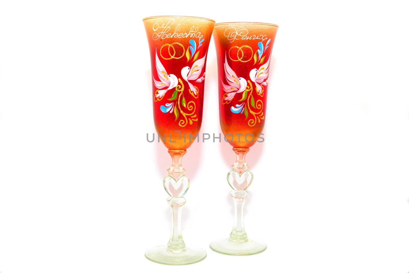 two beautiful wedding wineglasses on white background