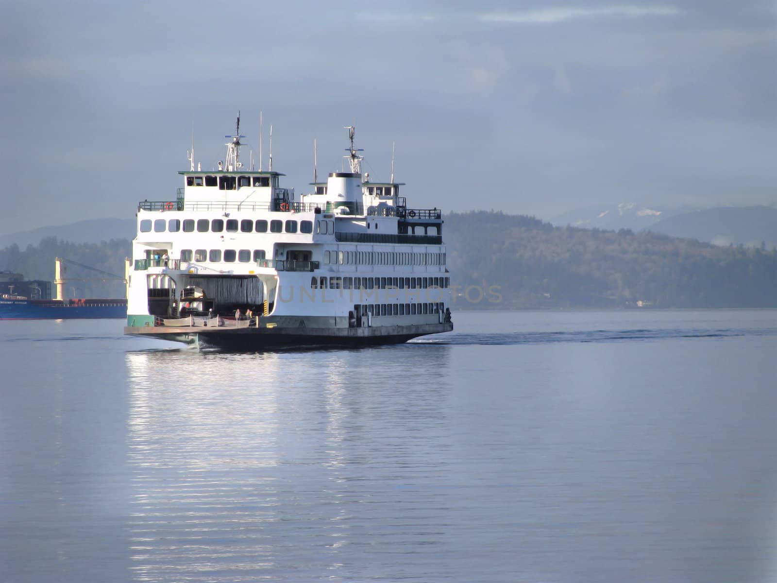 Washington State Ferry on the Puget Sound with the Olympic Mountains on the horizon.