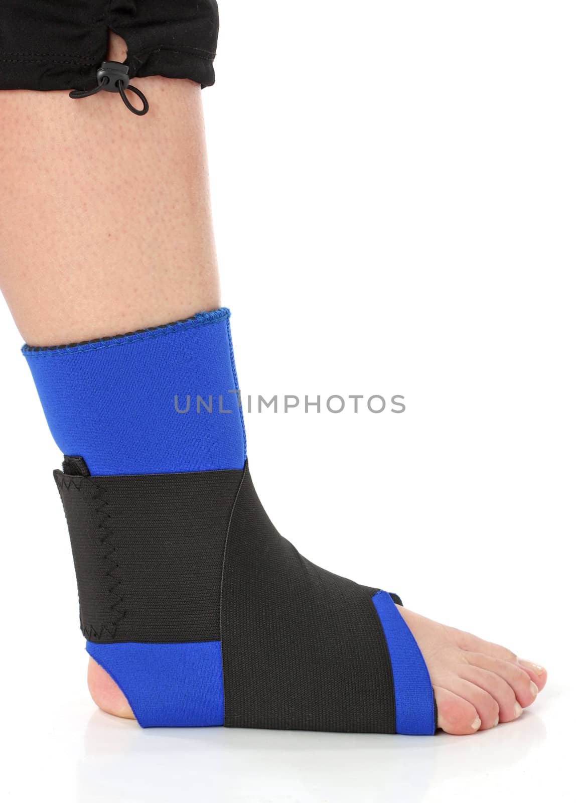 Foot with an ankle brace, over white