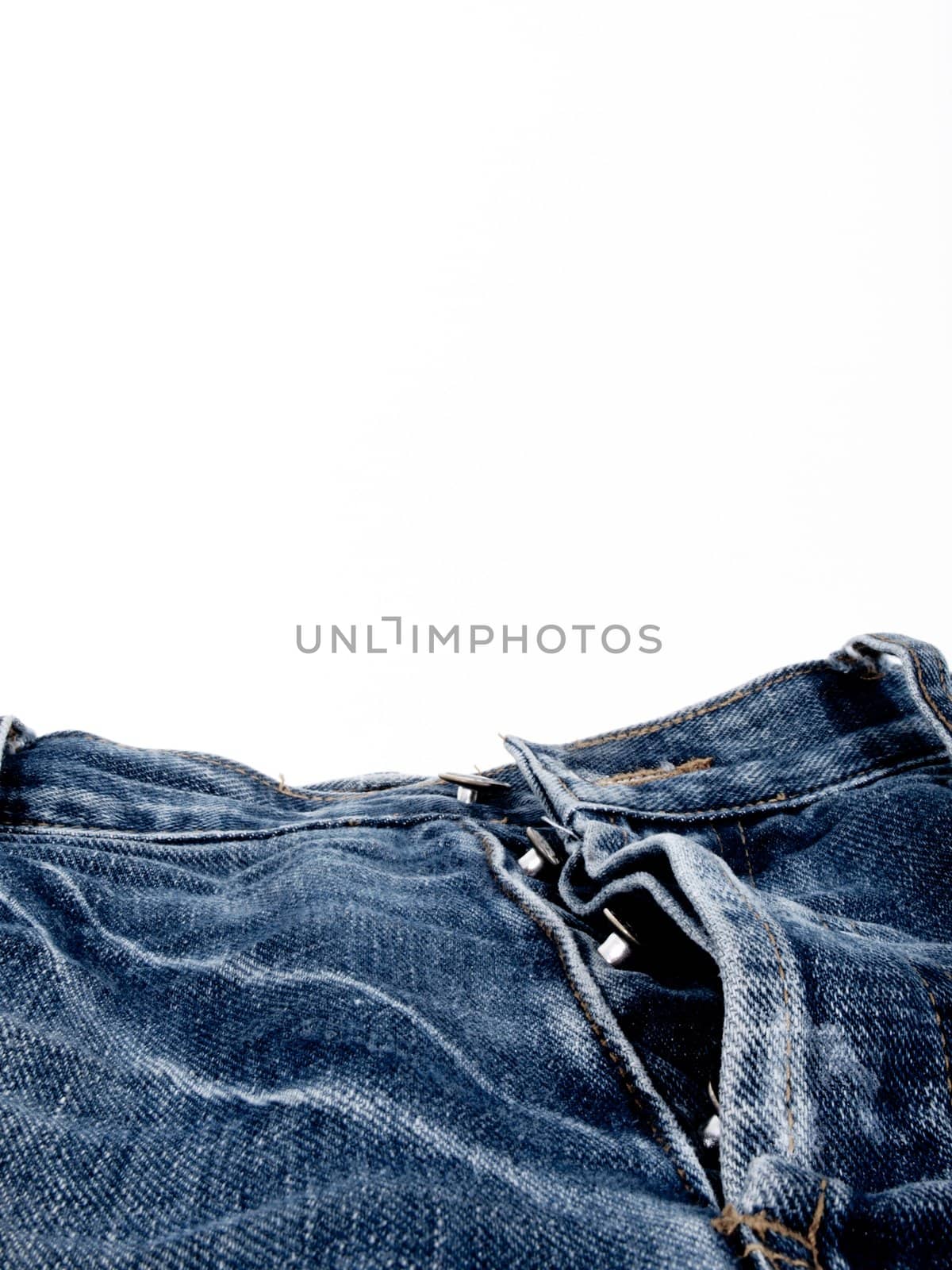 close-up button fly jeans on white background