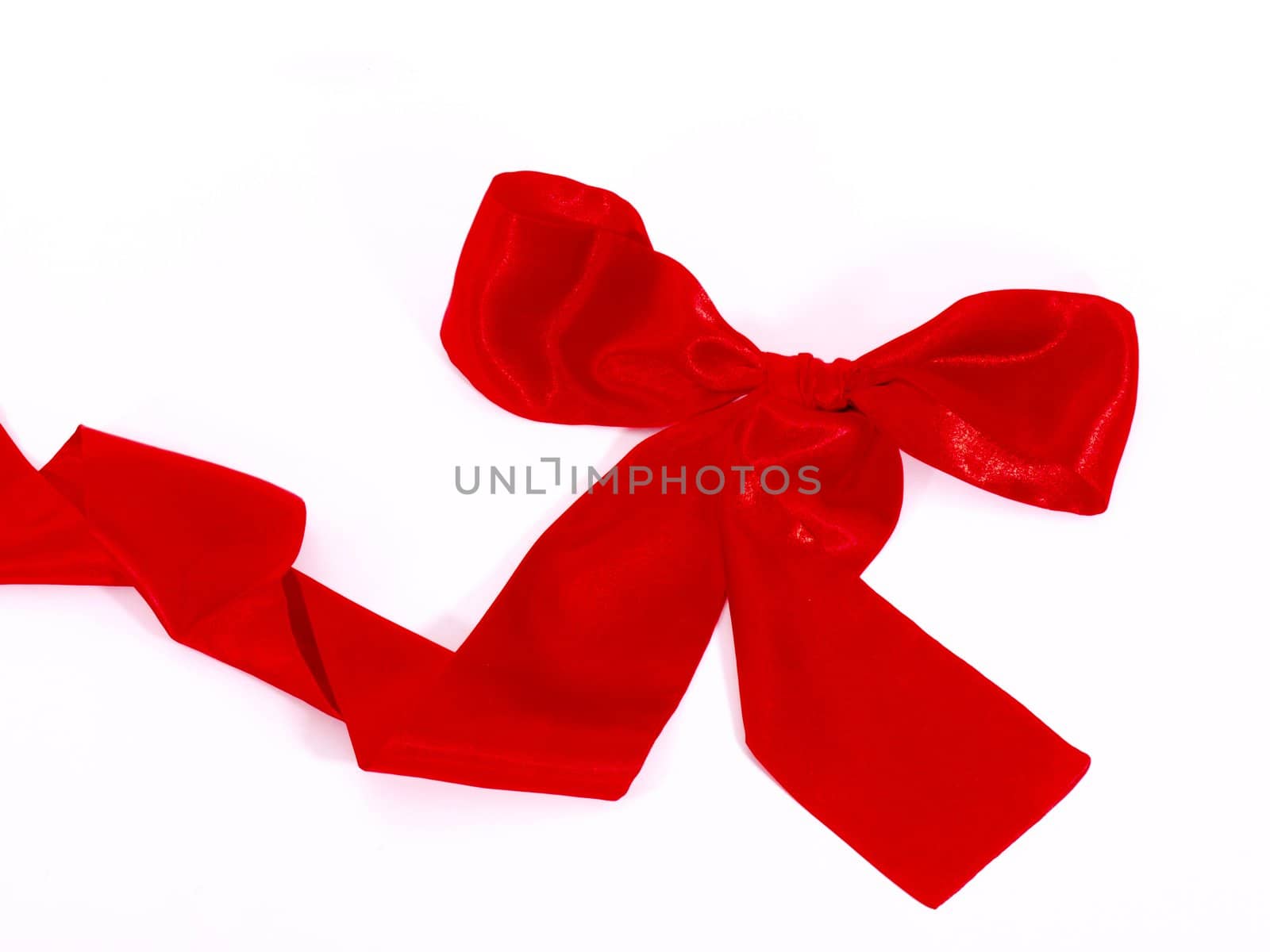Red scarf tied as a ribbon on white background