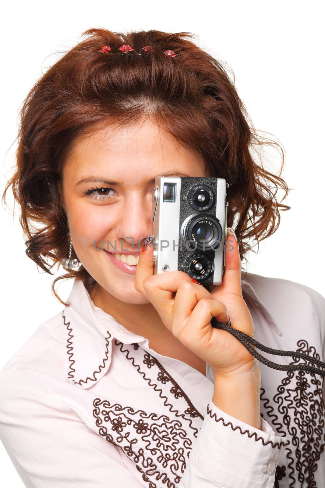 Woman taking a photograph with a classic camera