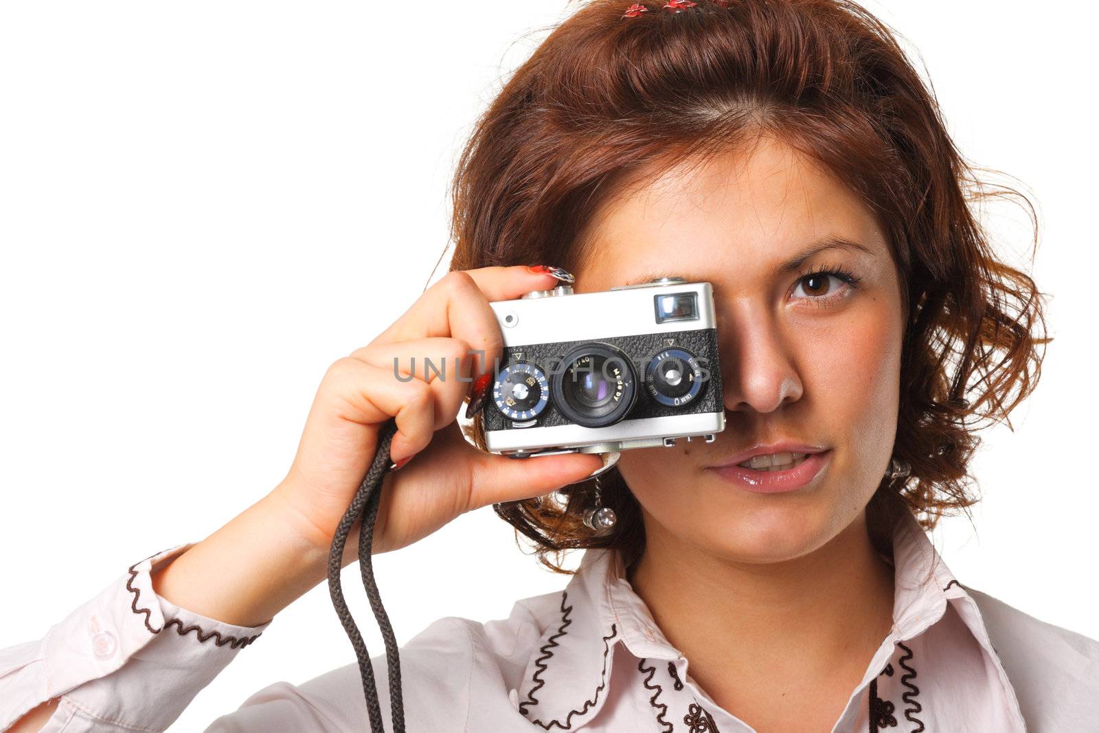 Woman taking a photograph with a classic camera