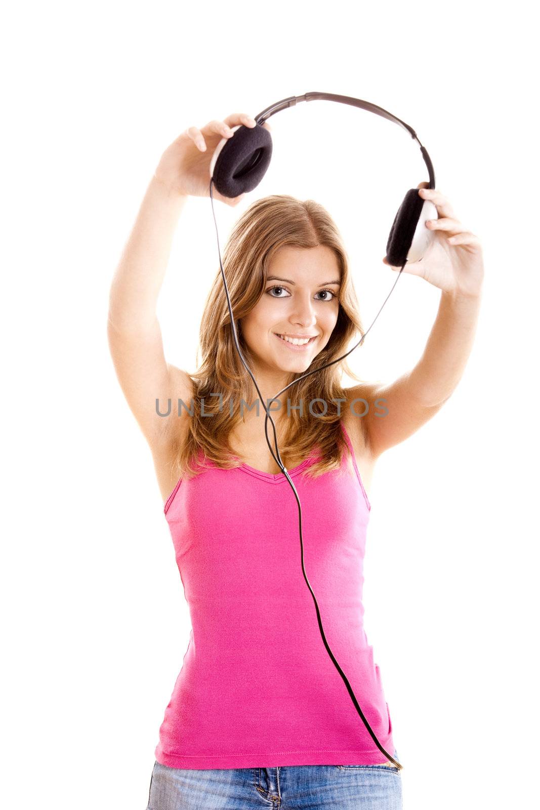 Beautiful young woman holding headphones isolated on white