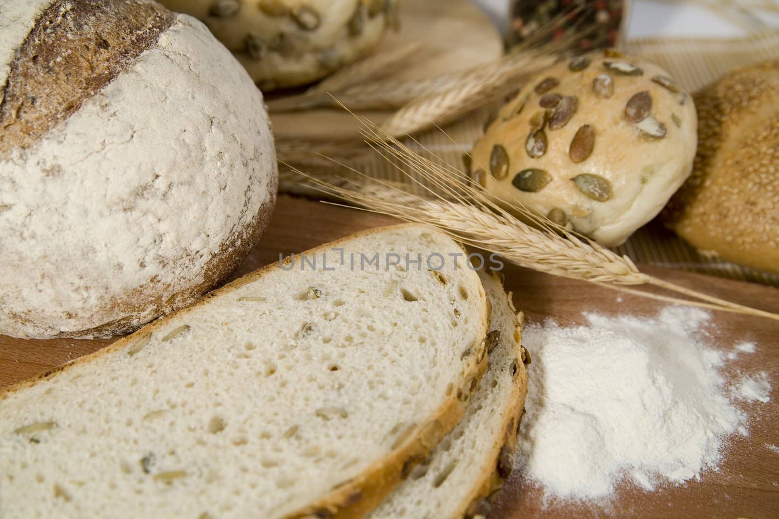 tasty and crispy fresh different kinds of bread with sour and wheat head