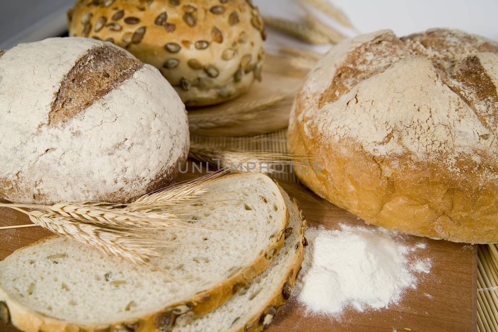 tasty and crispy fresh different kinds of bread with sour and wheat head