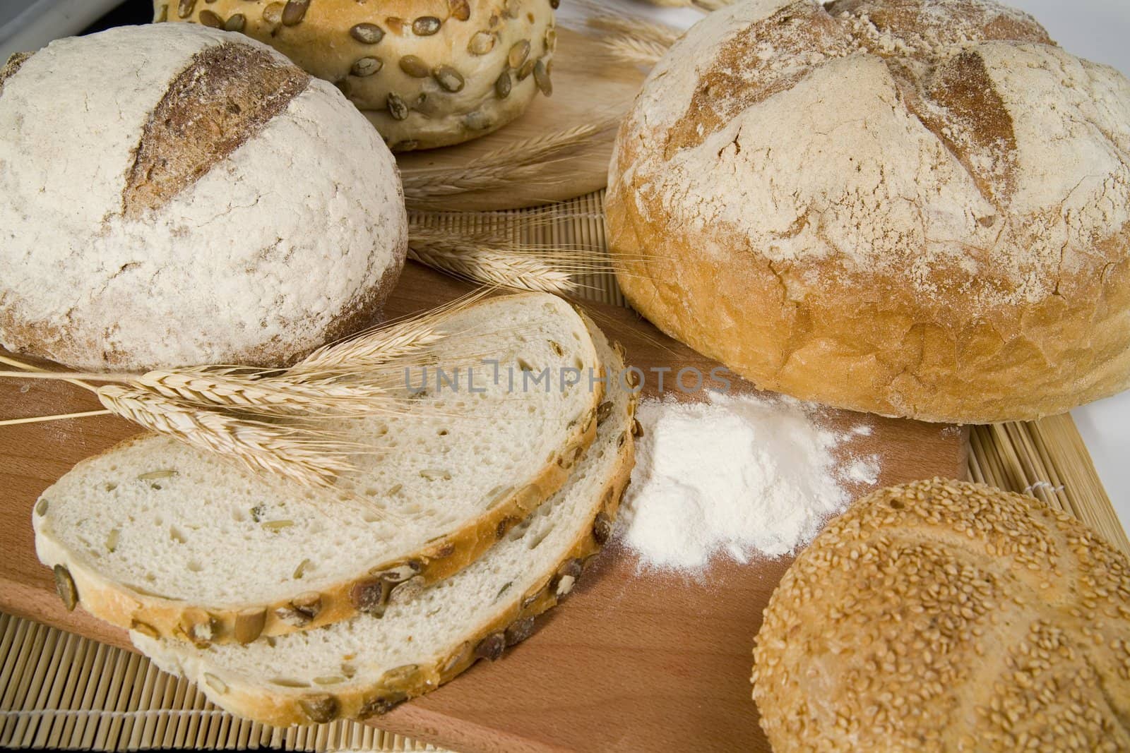 tasty and crispy fresh different kinds of bread with sour and wheat head