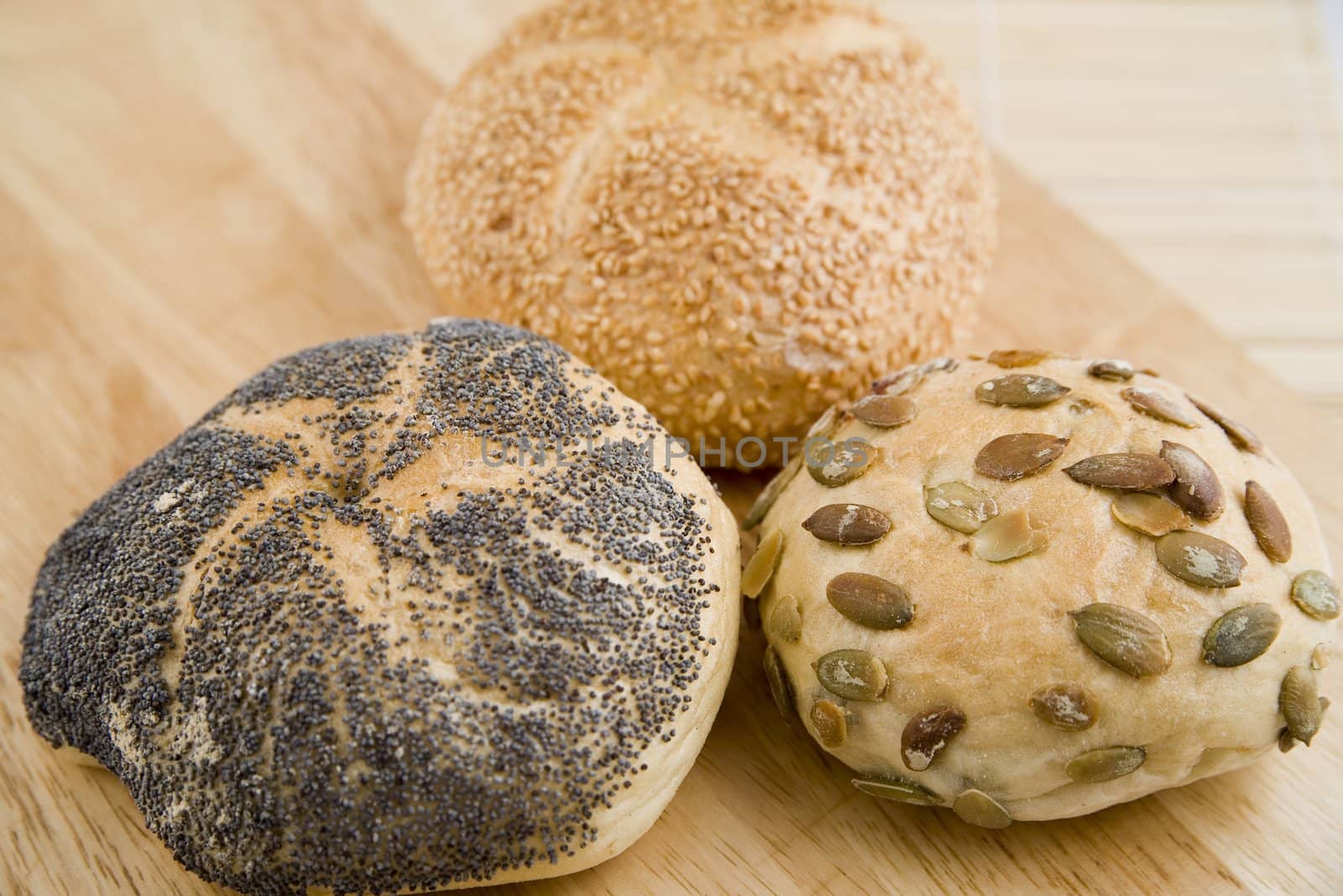 tasty and crispy fresh 3 rolls on wooden background