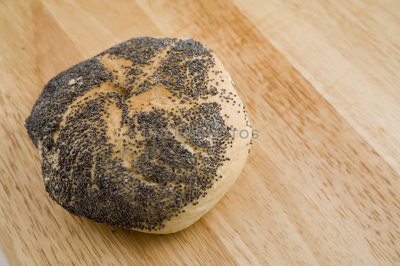 tasty and crispy fresh roll on wooden background