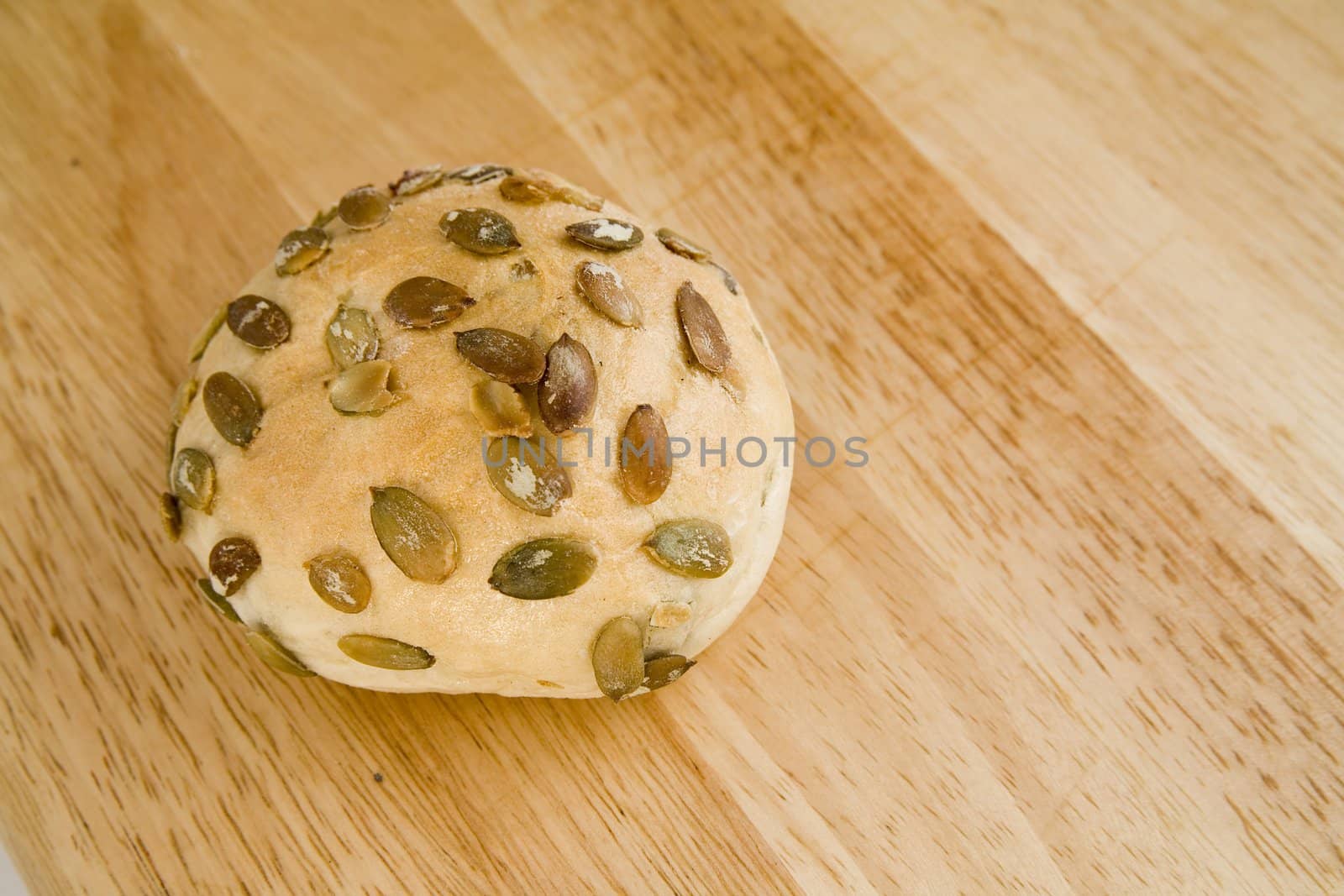 tasty and crispy fresh roll on wooden background