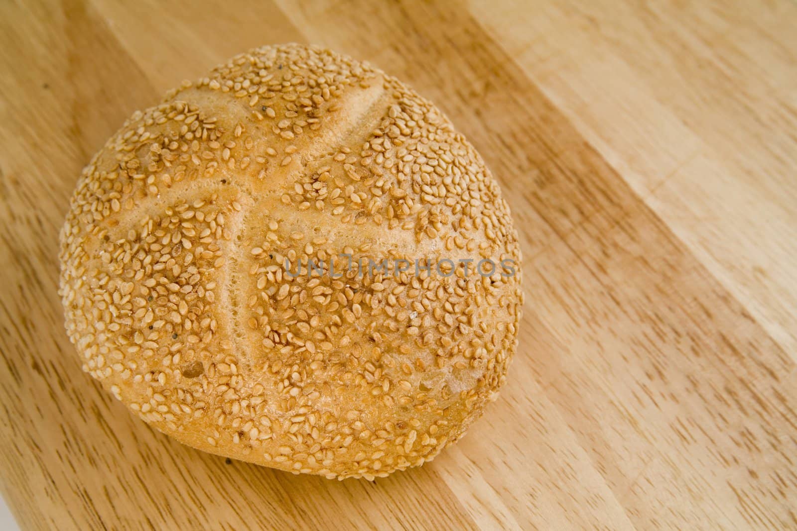 tasty and crispy fresh roll on wooden background