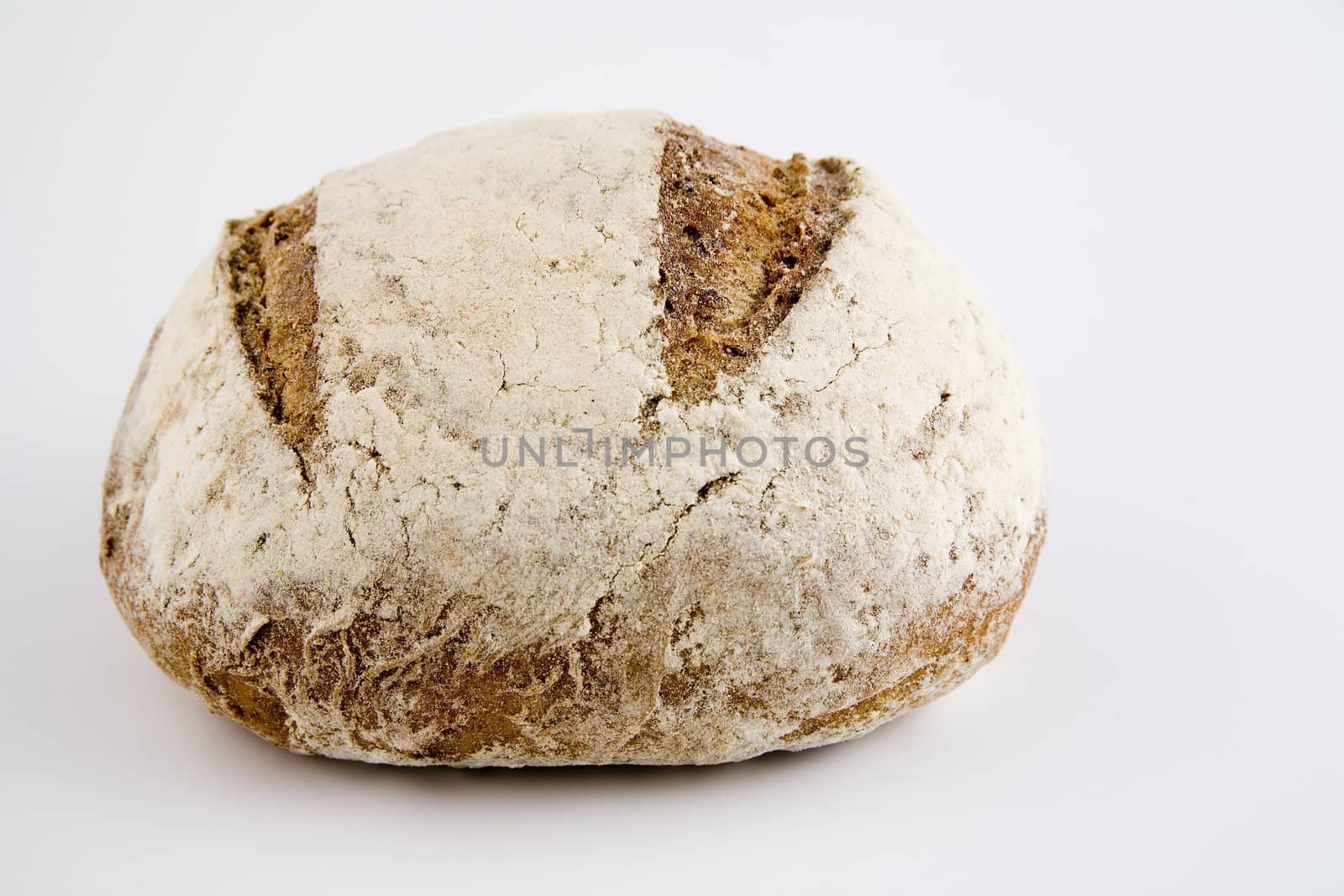 tasty and crispy fresh bread on white background