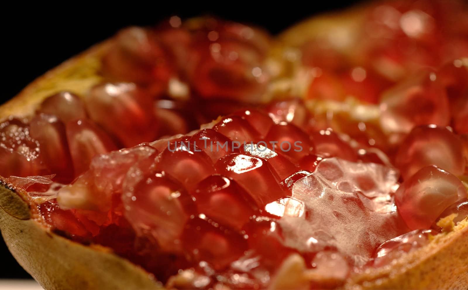 dettail close up of a pomegranate fruit open in half