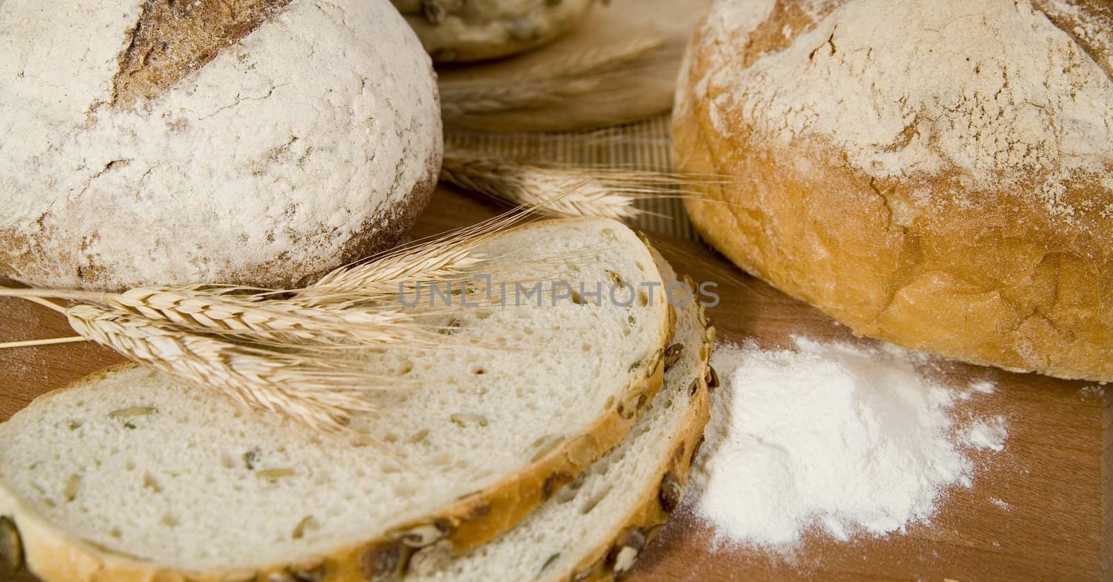 tasty and crispy fresh different kinds of bread with sour and wheat head