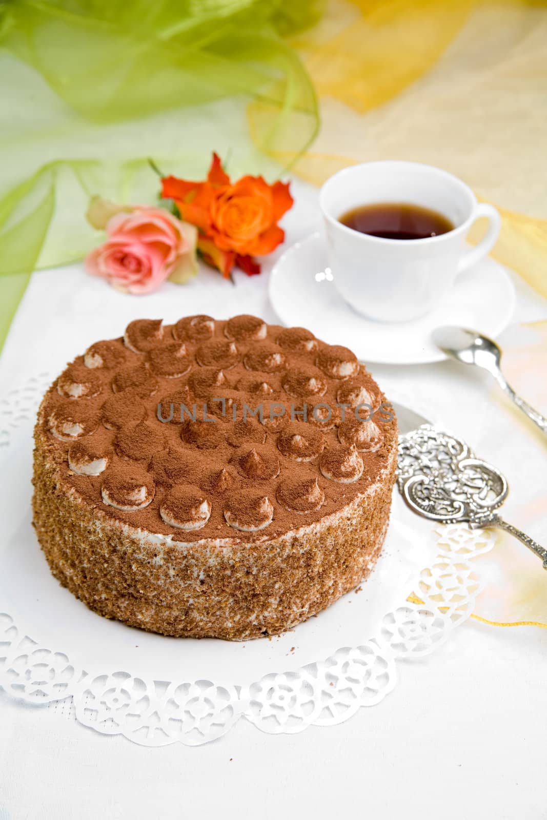 delicious cake with coffee and rose