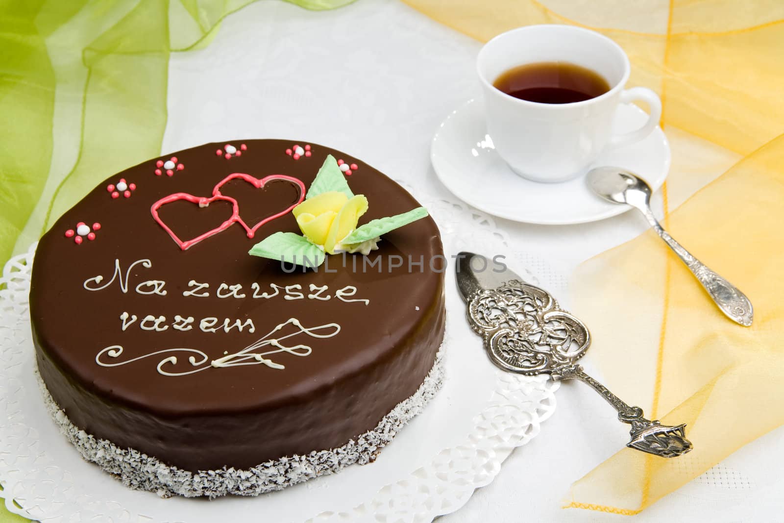 birthday cake with flower and a cup of coffee