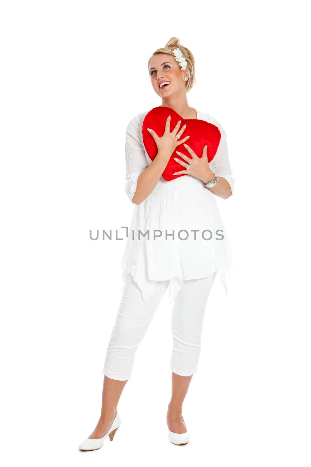 Beautiful blond girl with big red valentine heart