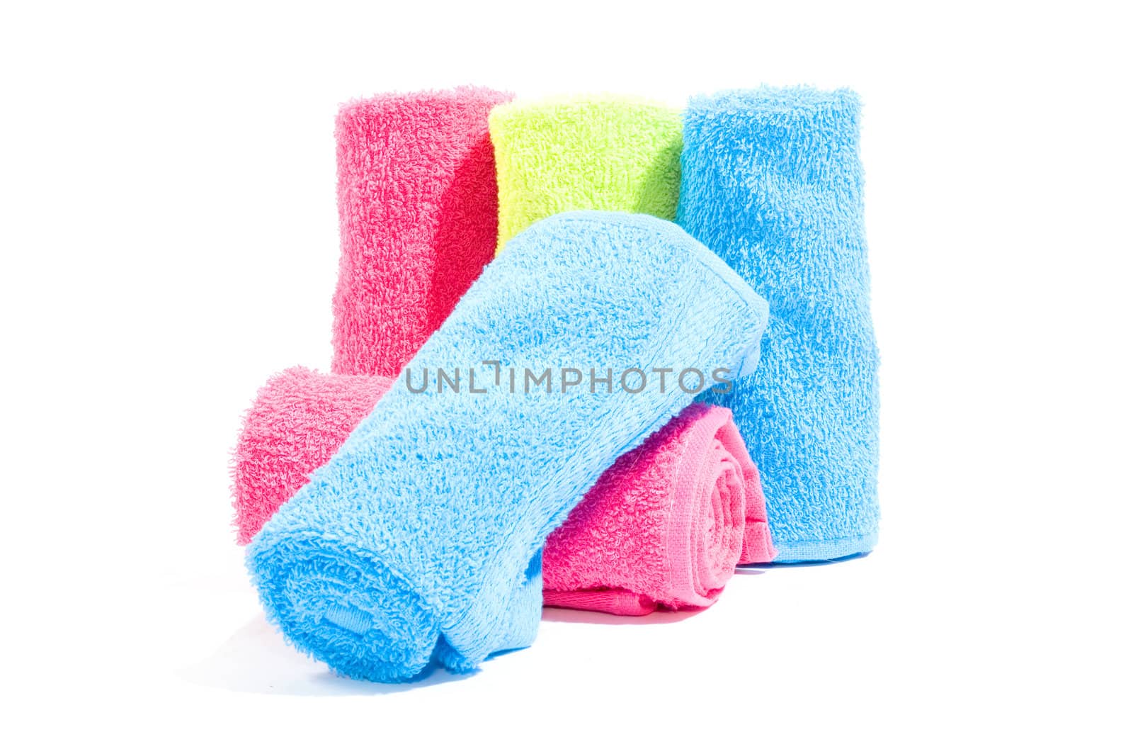 Colorful towel rolls on a white background  by ladyminnie