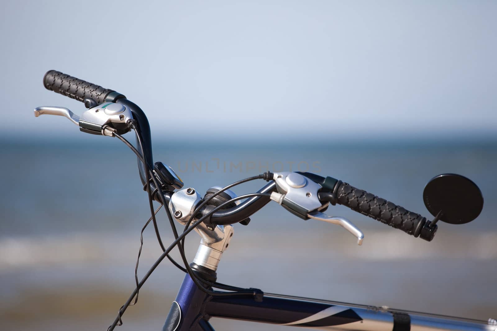 bike handlebar wheel over horizon of the sea