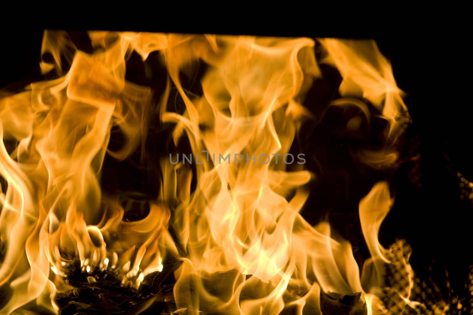 Flames of Fire in a fireplace.