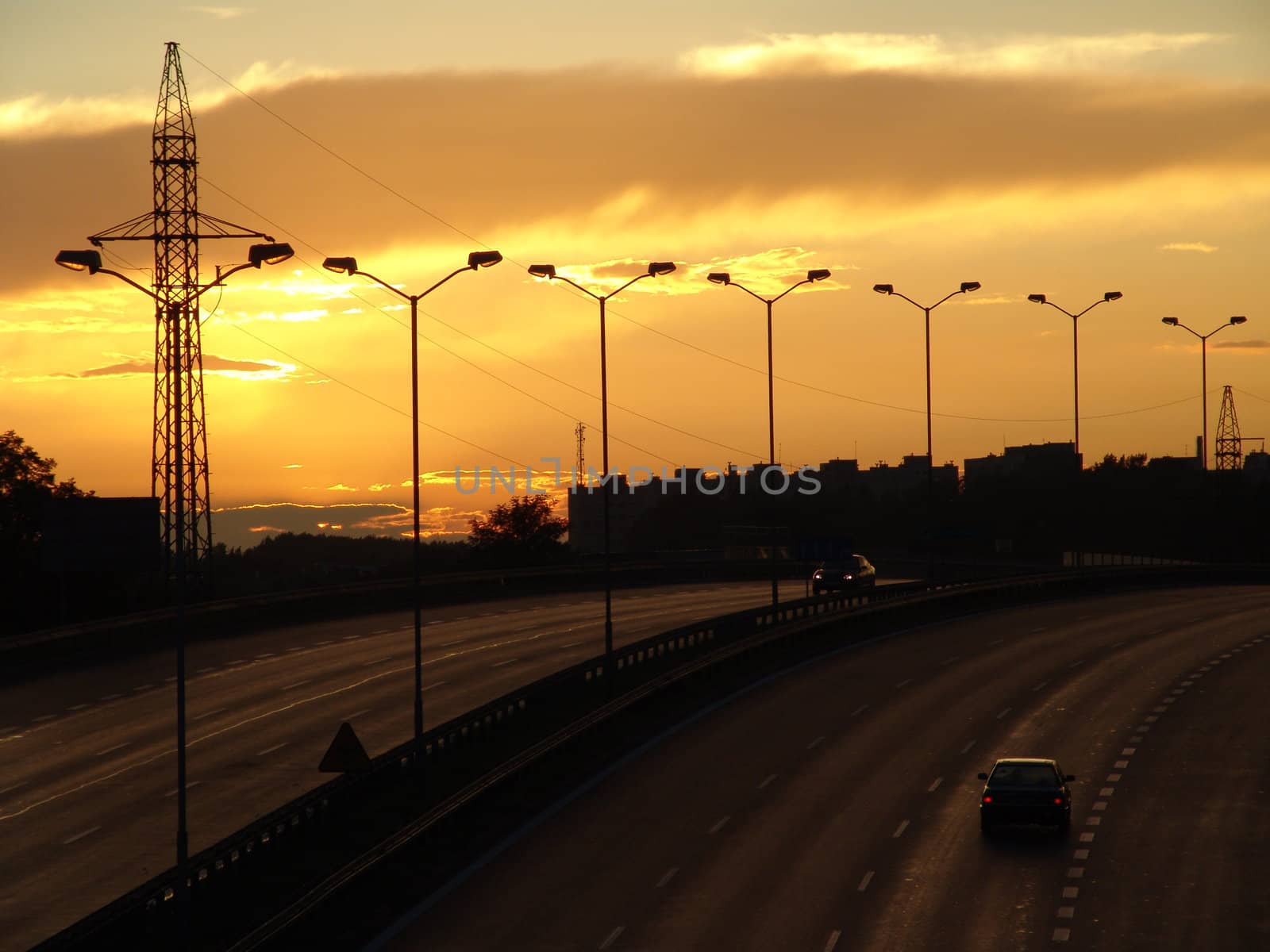 Sunset on the highway. Beautiful, scenic clouds.