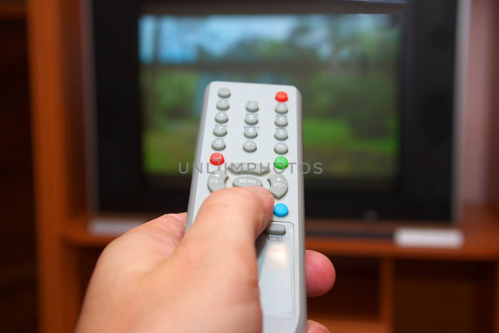 photo of the remote control switching channel on tv