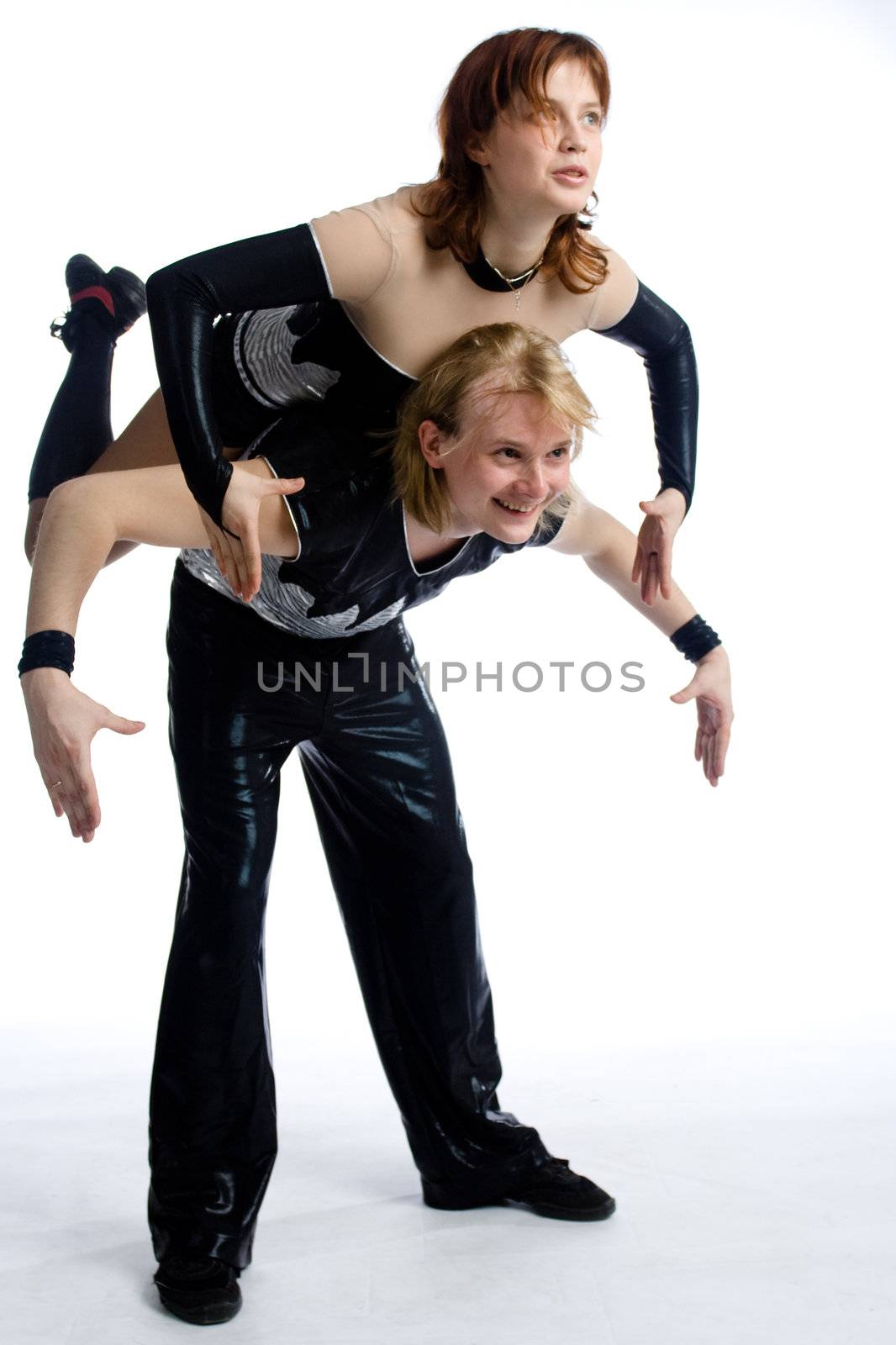 two dancers in same costumes on white
