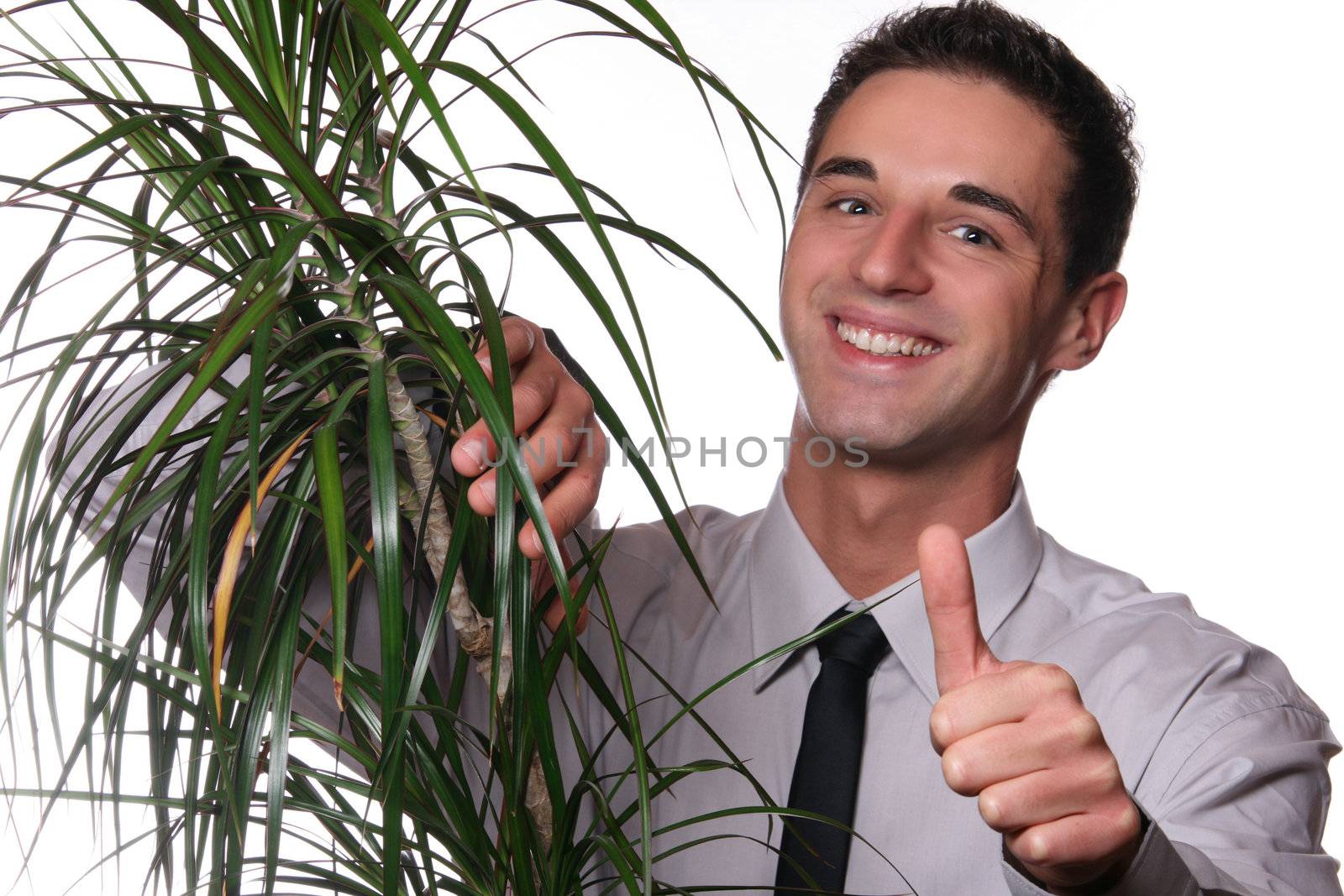 A Photo Of A Young Professional Man Holding A Plant