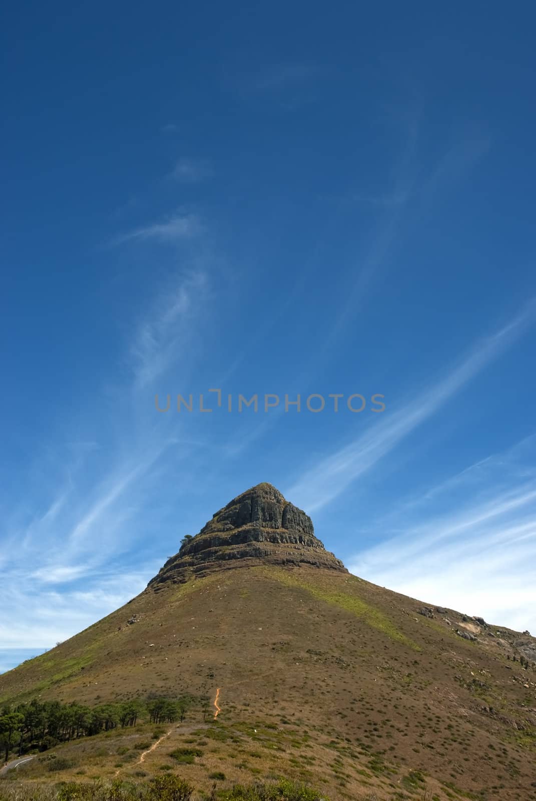 Lion's head, which is part of Table mountain with blue sky and clouds overhead