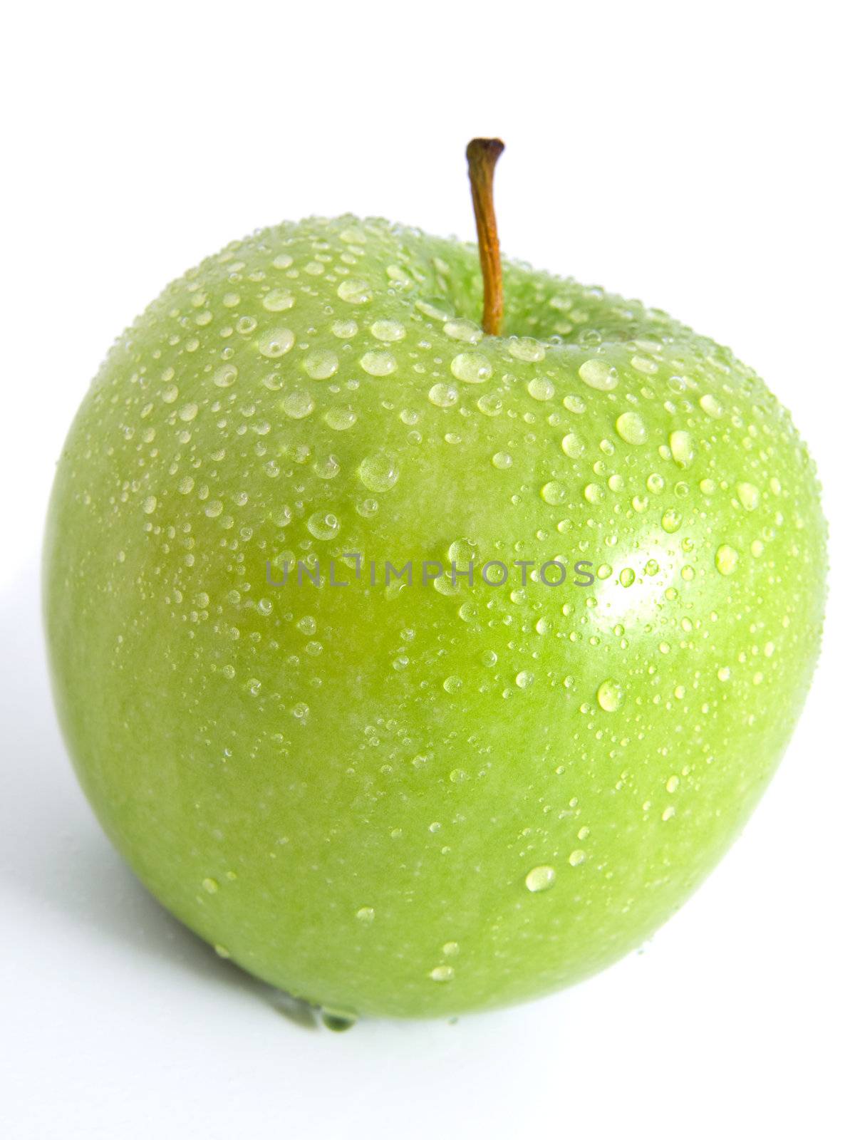 Juicy ripe green apple on a white background  by motorolka